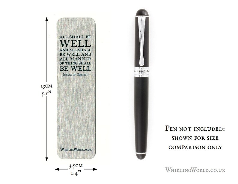 May include: A silver bookmark with the text "All shall be well and all shall be well and all manner of thing shall be well, Julian of Norwich" and a black pen for size comparison. The bookmark is 5.1 inches tall and 1.4 inches wide.