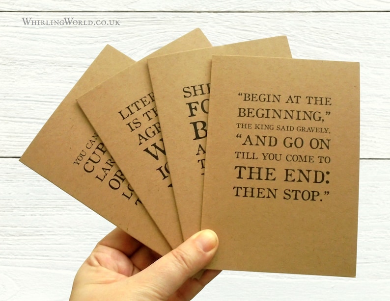 May include: Four brown cards with inspirational quotes printed in black ink. The quotes are: "You can cup your hands around the largeness of the world", "Literature is the art of agreement", "She fought for the right to be a bad girl", and "Begin at the beginning, the king said gravely. And go on till you come to the end: then stop."