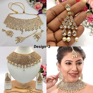 May include: A gold bridal jewellery set with white stones and pearls. The set includes a necklace, earrings, a maang tikka, and a matching bracelet. The jewellery is designed in a traditional Indian style.