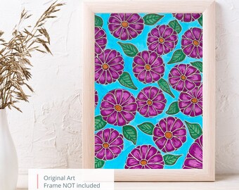 May include: A framed print of a colorful floral pattern. The print features a repeating pattern of purple flowers with orange centers on a light blue background. The flowers are outlined in black and have green leaves.