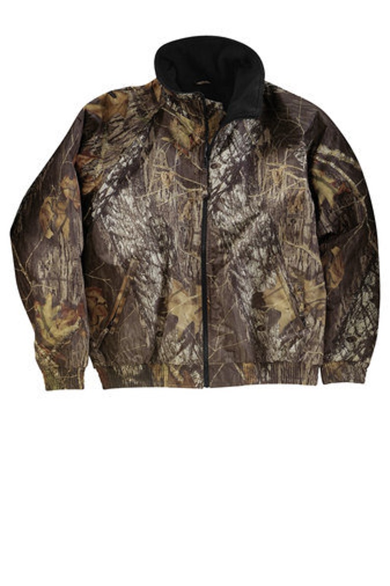 May include: A brown and green camouflage jacket with a zipper closure.