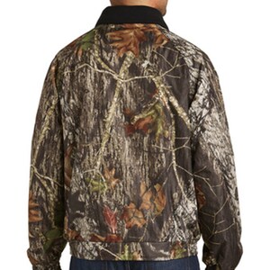 May include: A camouflage jacket with a black collar. The jacket has a zipper closure and long sleeves.