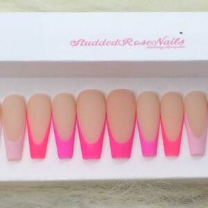 May include: Set of ten long, almond-shaped, false nails with a white tip and a gradient of pink and hot pink.