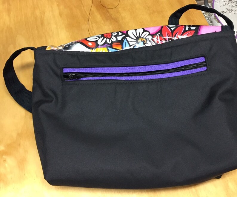 Graffiti style messenger bag.