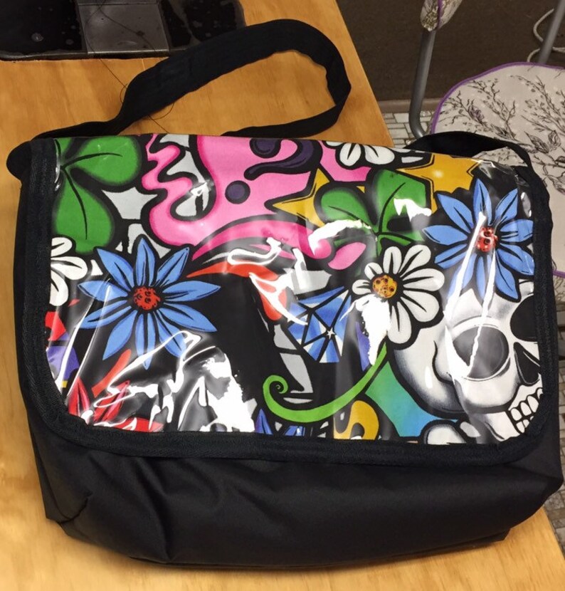 Graffiti style messenger bag.