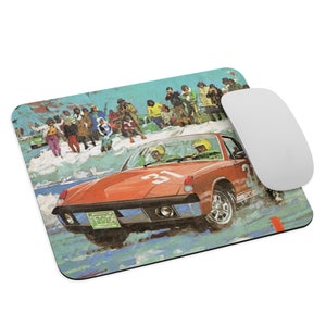 May include: A red Porsche 914 race car with the number 31 on the side, driving through a snowy landscape. The car is surrounded by spectators watching the race.