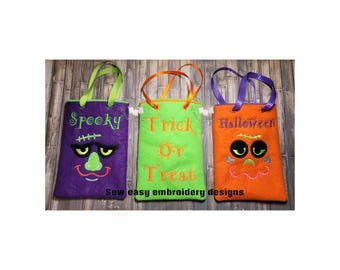May include: Three rectangular felt treat bags with handles. The purple bag features the text Spooky and a monster face. The lime green bag features the text Trick Or Treat. The orange bag features the text Halloween and a monster face.
