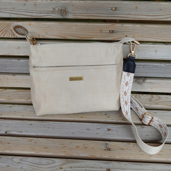 Crossbody shoulder roomy handbag handmade in faux suede fabric. Lots of pockets and card sleeves. Adjustable webbing strap. Hands free bag