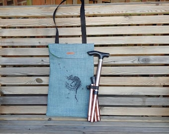 Folding walking stick carry bag. Handmade storage for mobility cane. Shoulder strap or hang on your wheelchair or scooter. Accessible gift