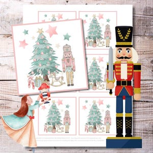 May include: Watercolor Christmas-themed art print featuring a ballerina, a nutcracker, Christmas trees, and other festive elements. The design includes pink and green stars, a rocking horse, and gift boxes. The art is set against a wooden background.
