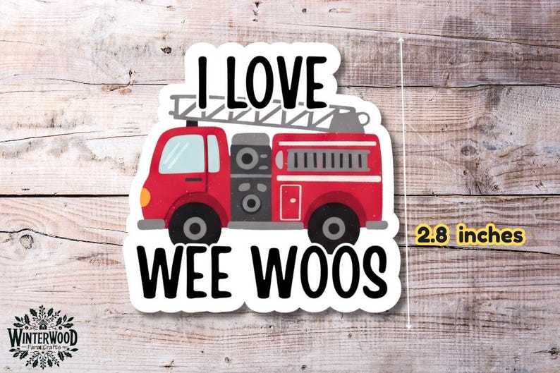 Op de afbeelding: Een sticker met een rode brandweerwagen met de tekst "I LOVE WEE WOOS". De sticker is ongeveer 7,1 cm hoog. De brandweerwagen heeft een ladder bovenop en zwarte wielen.