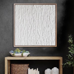 Minimalist white abstract textured painting on canvas.
The painting changes with the different light of day, always creating new lights and shadows.
The clean white is perfect for the minimalist design lover.