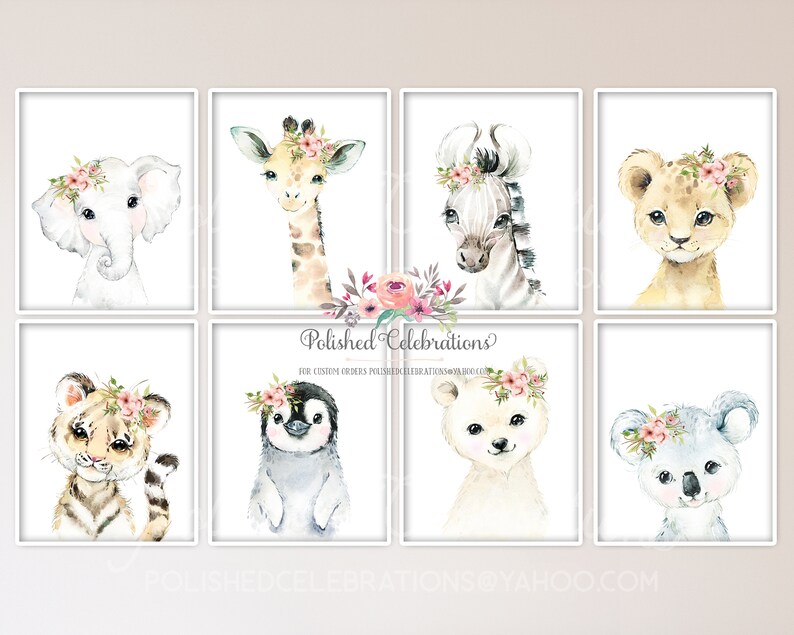 May include: Set of eight watercolor animal prints featuring a giraffe, zebra, lion, elephant, tiger, penguin, bear, and koala. Each animal is wearing a pink floral crown. The prints are perfect for a nursery or child's room.