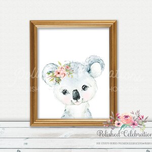 May include: A watercolor painting of a koala bear with a pink flower crown. The koala is looking at the viewer with a sweet expression. The background is white.