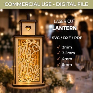 May include: A laser-cut wooden lantern featuring the text "Mr & Mrs" and heart cutouts. The digital file includes SVG, DXF, and PDF formats for 3mm, 3.2mm, 4mm, and 5mm material thicknesses. The lantern is illuminated from within by warm light.