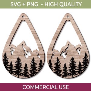 May include: Two wooden teardrop-shaped earrings with a mountain and forest design. The earrings are light brown with a black mountain and tree silhouette. The text "SVG + PNG - HIGH QUALITY" and "COMMERCIAL USE" are visible.