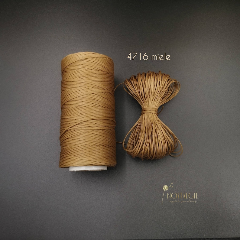 May include: A spool of brown waxed cord with the number 4716 and the word "miele" printed on a white label. The cord is also shown in a separate pile.