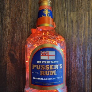 Pusser&#39;sRum Illuminated Liquor bottle.  LED Battery operated lights. Orange color lights