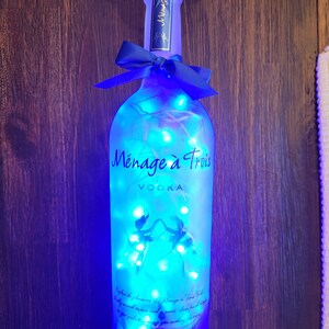 Menage a Trois Vodka Liquor bottle.  LED Battery operated lights.