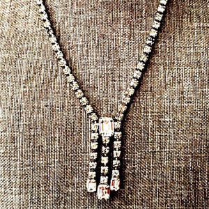 May include: A set of three ceramic mugs with a speckled, matte finish. The mugs are in shades of cream, light gray, and dark gray. Each mug has a simple, minimalist design, perfect for coffee or tea.