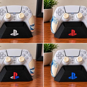 May include: A white game controller with a blue and beige wave pattern on the grips and light beige thumbsticks, resting on a black trapezoidal charging stand. The stand features a PlayStation logo in white, red, blue, or light blue colors.