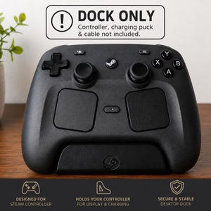 May include: A black plastic desktop dock for a Steam controller. The dock features a central Steam logo and a rectangular base. Text above reads: DOCK ONLY. Controller, charging puck & cable not included. Bottom text: DESIGNED FOR STEAM CONTROLLER, HOLDS YOUR CONTROLLER FOR DISPLAY & CHARGING, SECURE & STABLE DESKTOP DOCK.