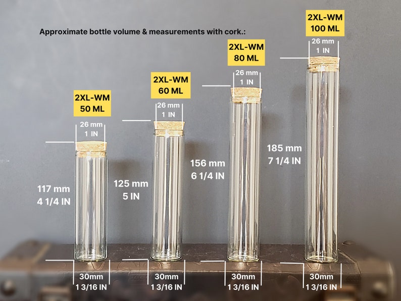 May include: Four clear glass bottles with cork stoppers and measurements in millimeters and inches. The bottles are labeled with the text "2XL-WM" and the volume in milliliters. The bottles are arranged from smallest to largest.