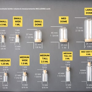 May include: A chart showing different sizes of glass bottles with cork stoppers. The bottles are labeled with their approximate volume in milliliters and their height and width in millimeters and inches. The chart includes small, medium, and large bottles with different shapes, including dome, wide, and tall.