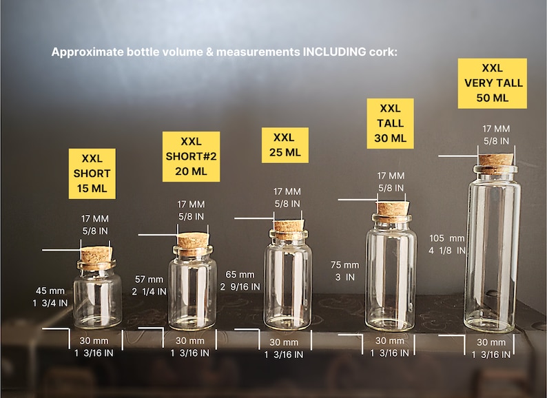 May include: Five glass bottles with cork stoppers, ranging in size from 15 ml to 50 ml. The bottles are labeled with their volume and measurements in millimeters and inches.  Approximate bottle volume & measurements INCLUDING cork: