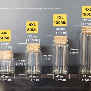 May include: Four clear glass bottles with cork stoppers and measurements in millimeters and inches. The bottles are labeled 4XL 50ML, 4XL 80ML, 4XL 100ML, and 4XL 150ML.