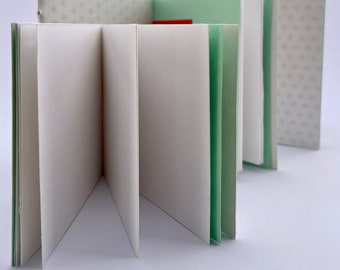 Set of Saddle-stitched Polka-dot and Plain Notebooks, with Foldouts and Other Surprises