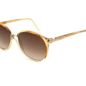 Versace sunglasses, made in Italy in the 80s. Authentic vintage sunglasses for women, tagged