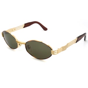 Lunettes de soleil vintage par Lozza, fabriquées en Italie. Lunettes de soleil dorées hexagonales, unisexe