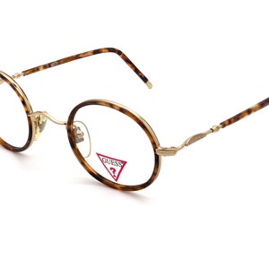 Vintage eyeglasses by Guess. Round glasses 90s in gold or silver, authentic, tagged