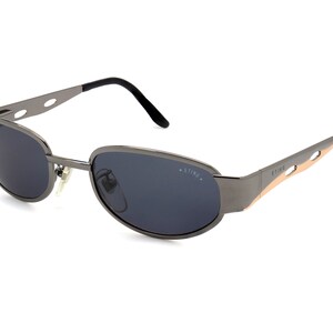 Sting vintage sunglasses 90s, made in Italy. Art Deco sunglasses with spring hinges