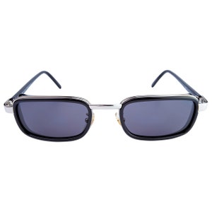 May include: Black sunglasses with a silver metal frame and dark lenses.