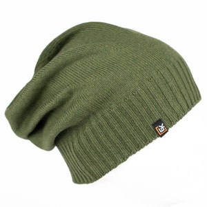 May include: A green knitted beanie with a small black and orange logo on the side.