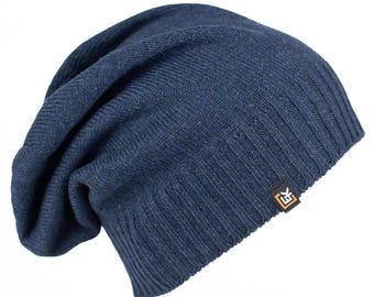 May include: A blue slouchy beanie with a small orange and white logo on the side.