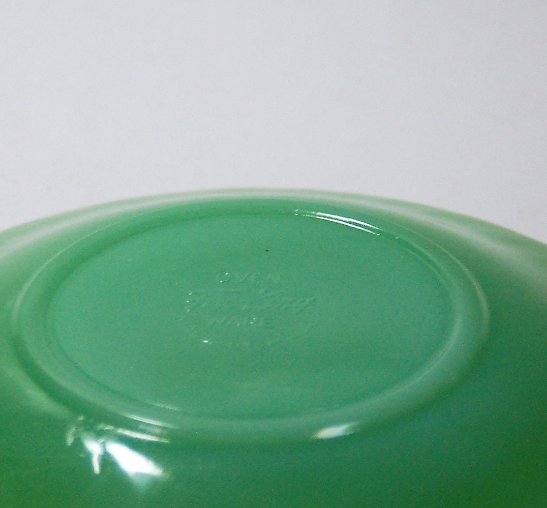 Jadeite 53/4 saucers. Set of four Fire King Oven Glass, Jane Ray pattern.