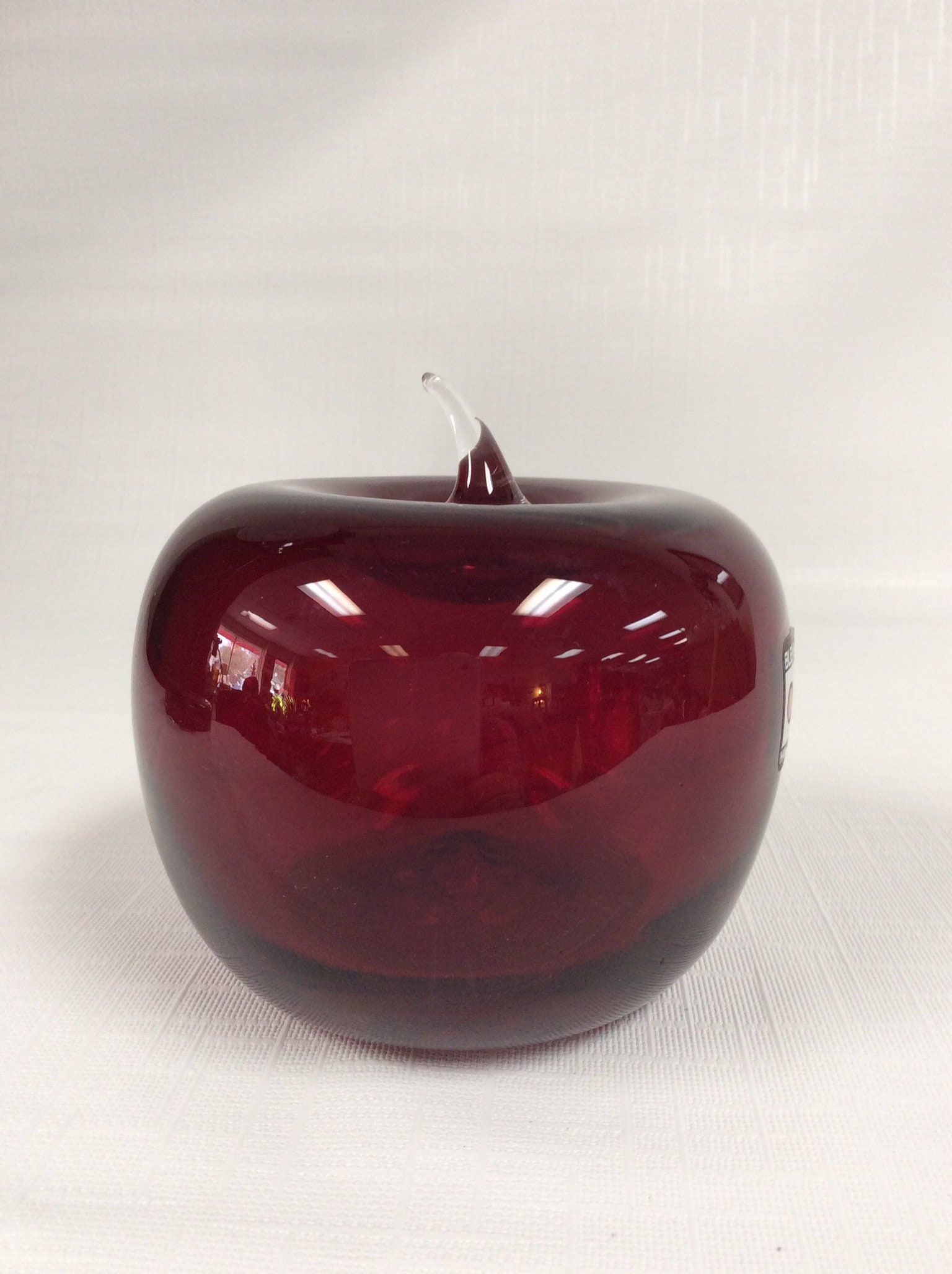 Blenko Glass ruby red apple with crystal stem.