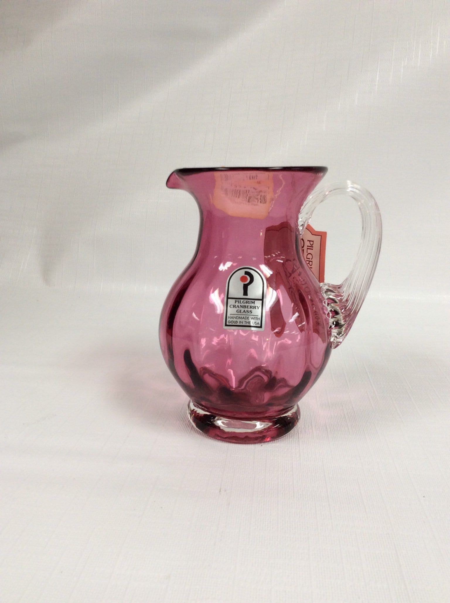 Pilgrim Glass mini vase in cranberry with crystal reeded handle