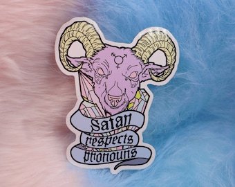 May include: A pink and blue fuzzy background with a sticker of a purple goat with horns and a transgender symbol on its forehead. The sticker says "Satan respects pronouns".