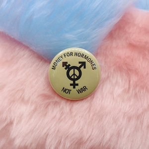 Money For Hormones Not War Button Badge