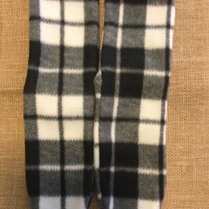 May include: A pair of black and white checked fleece socks.