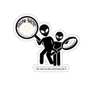 May include: A sticker with a black silhouette of two aliens with magnifying glasses. The sticker includes the text "PROBE BROS Investigative Services" in a circular design, and the text "We Get to the Bottom of It".