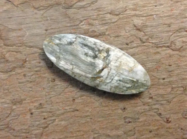 White Canadian Tiger Eye Cabochon.