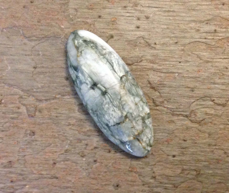 White Canadian Tiger Eye Cabochon.