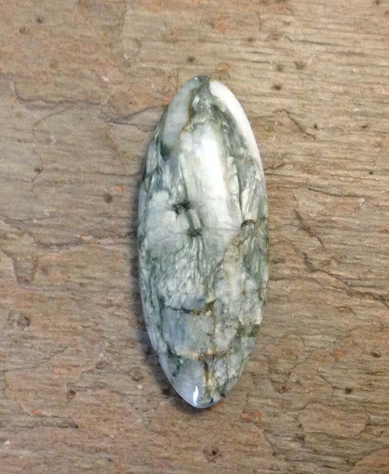 White Canadian Tiger Eye Cabochon.