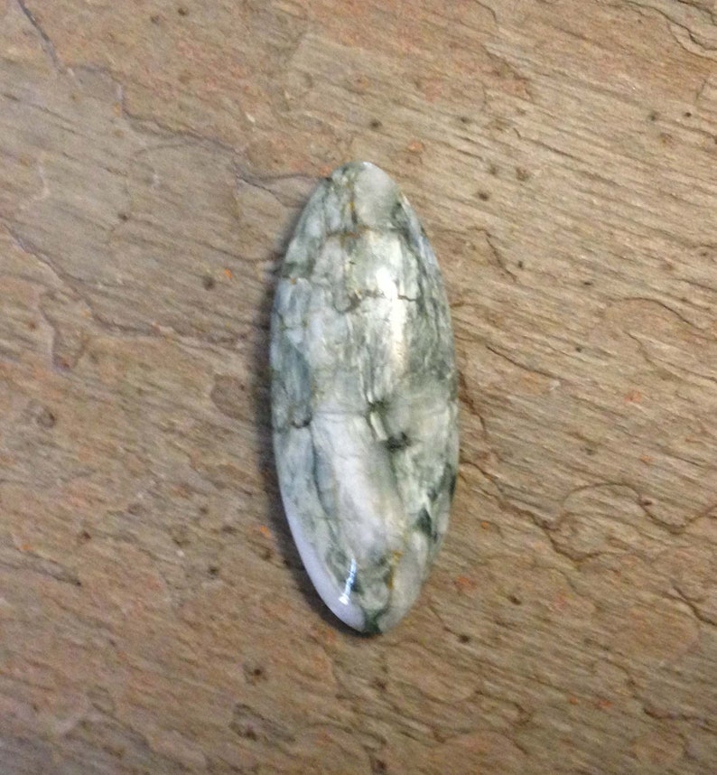 White Canadian Tiger Eye Cabochon.