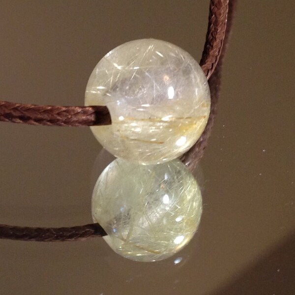 Hand Carved Rutilated Quartz Bead.